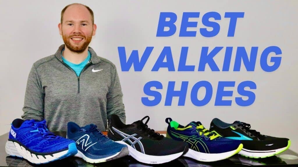 Picture of James McCormack sitting at a desk with 4 shoes in front of him to review for the best shoes for standing all day