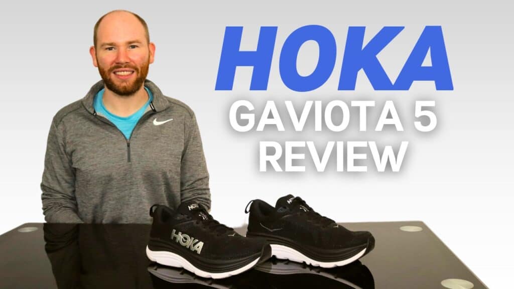 Picture of James McCormack sat at a desk with the Hoka Gaviota 5 in front of him for review