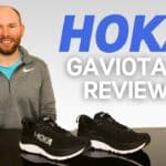 Picture of James McCormack sat at a desk with the Hoka Gaviota 5 in front of him for review