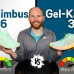 James McCormack sitting at a desk holding the Asics gel nimbus 26 and the asics gel kayano 31 for review