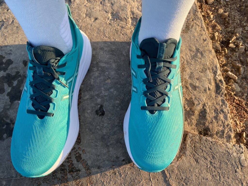 Top down view of the upper of the Asics Gel Nimbus 27 in Wave Teal/Saxon Green