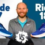 Picture of James McCormack providing a review of the saucony ride 18 vs the guide 18 at a desk with a shoe in each hand