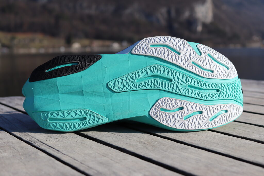 Photo of the New Balance Fuelcell Rebel V4 Outer sole at annecy lake