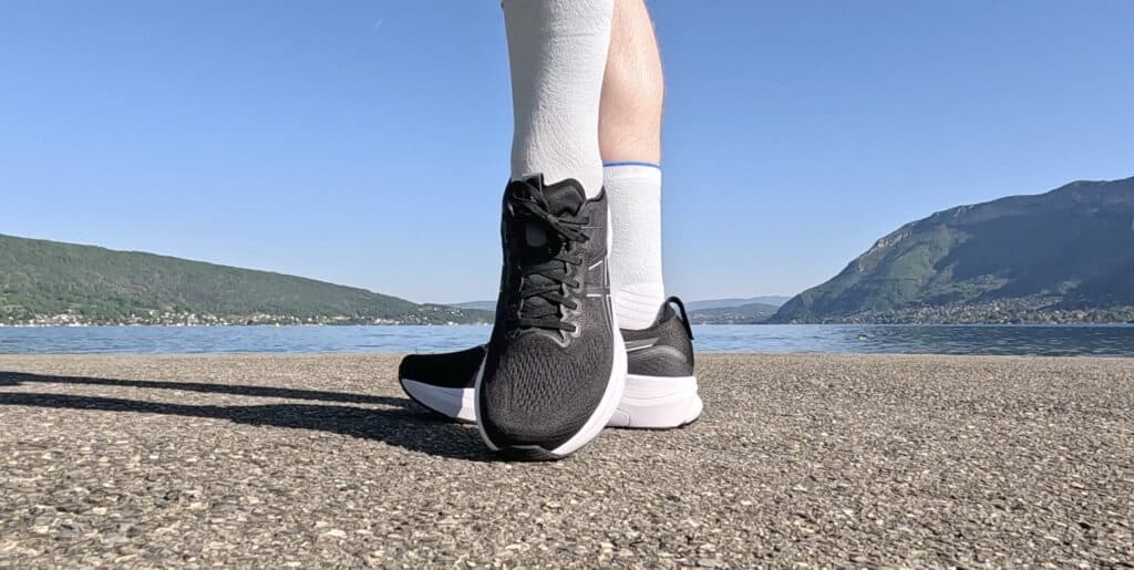 Photo of james mccormack wearing the asics gel kayano 32 in black and white with a front view of the shoes