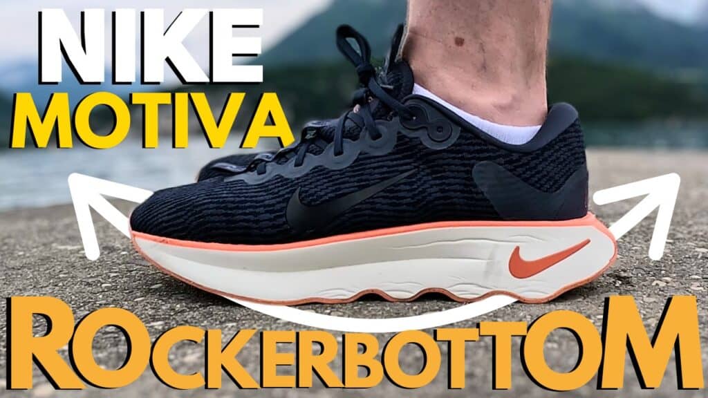 Picture of the nike motiva from the side in navy orange and white