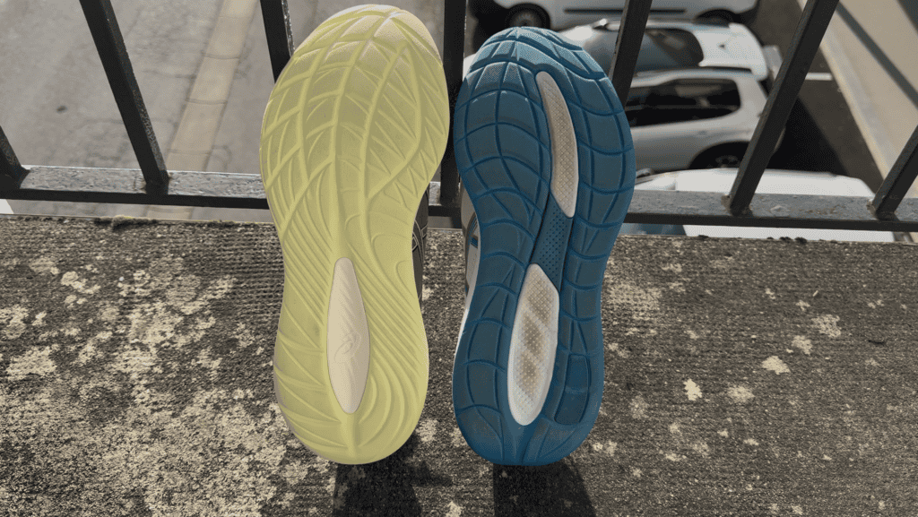 Photo of the asics gel cumulus 28 on the right and 27 on left showing the differences in outsole rubber